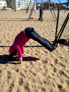 Working on a pike up from a plank, using the MostFit Suspension Strap